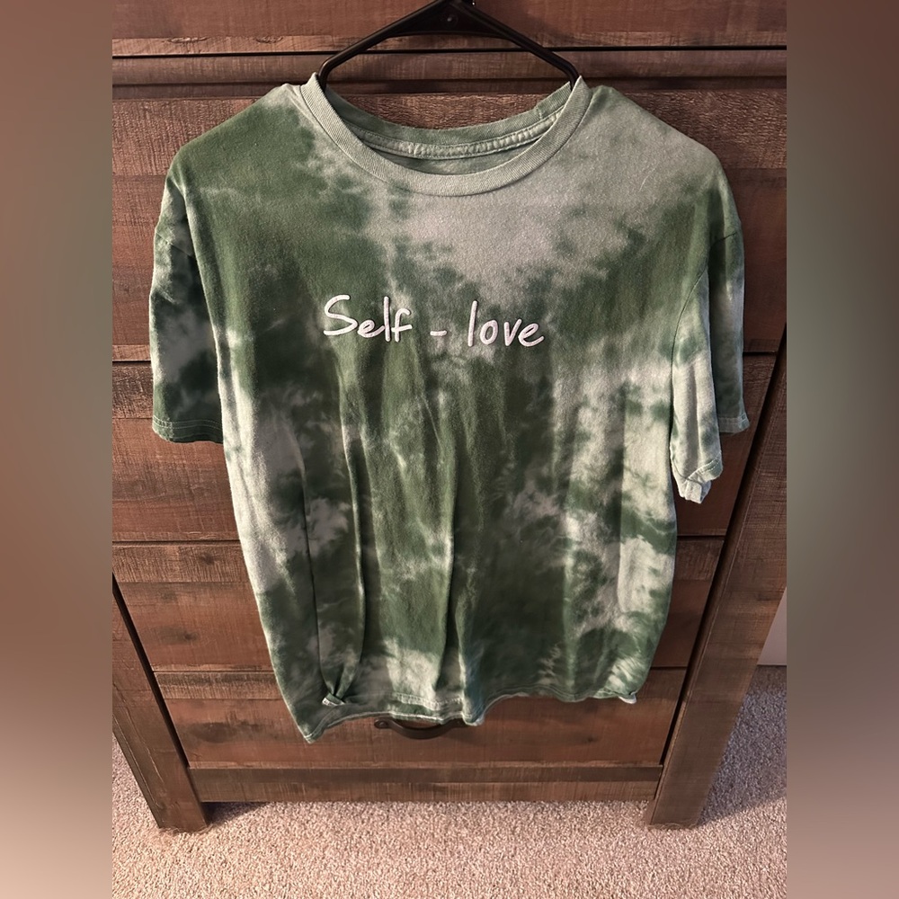 Large green t-shirt with wording